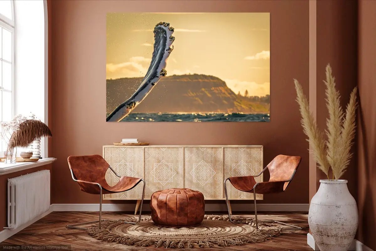 Living room with two brown chairs, a round ottoman, and a large abstract painting on the wall.