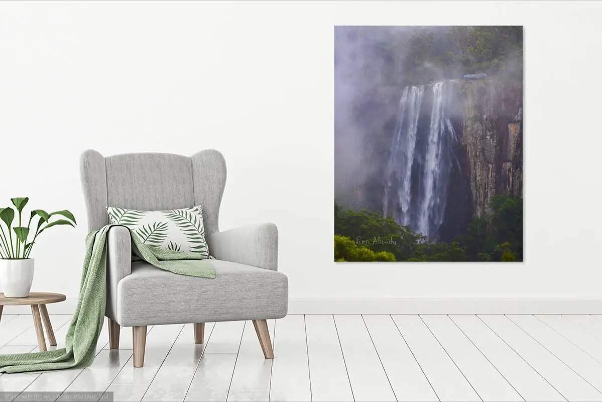 Moody Minion Falls wall art in a room with a chair and plant