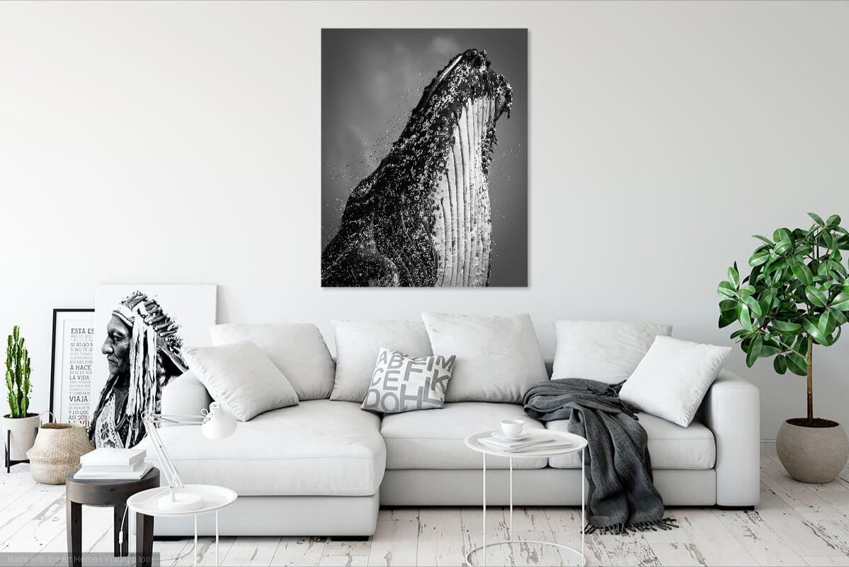 White living room with a whale painting on the wall above a sofa.